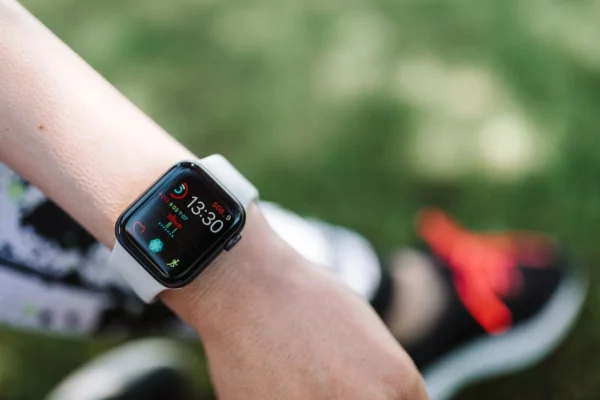 Close-up of a smartwatch on a wrist showing health data