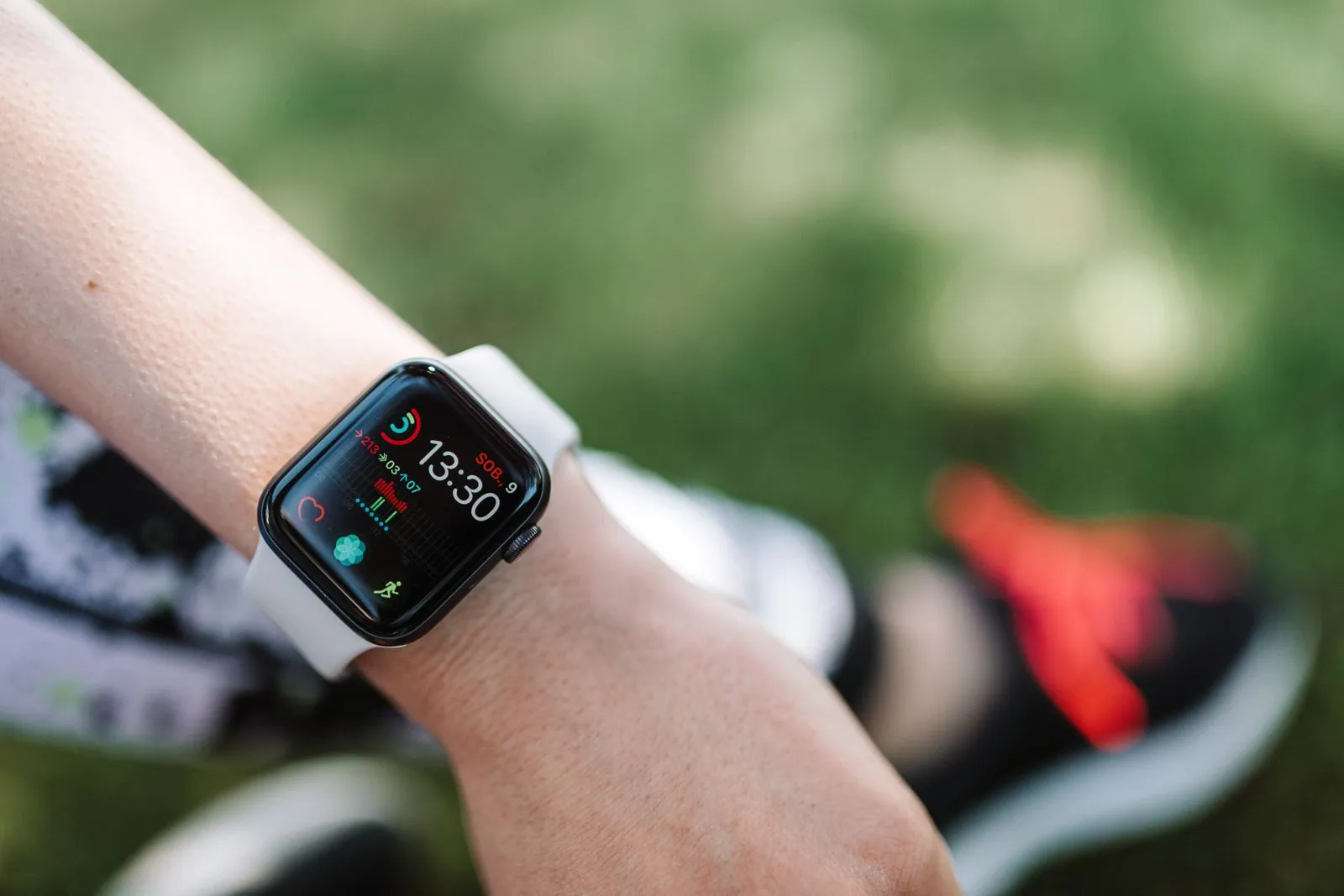 Close-up of a smartwatch on a wrist showing health data